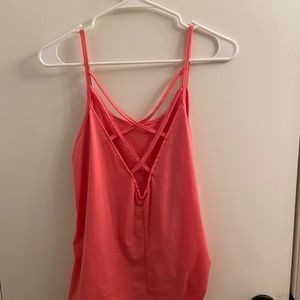 Pink tank top with open back. Size medium.